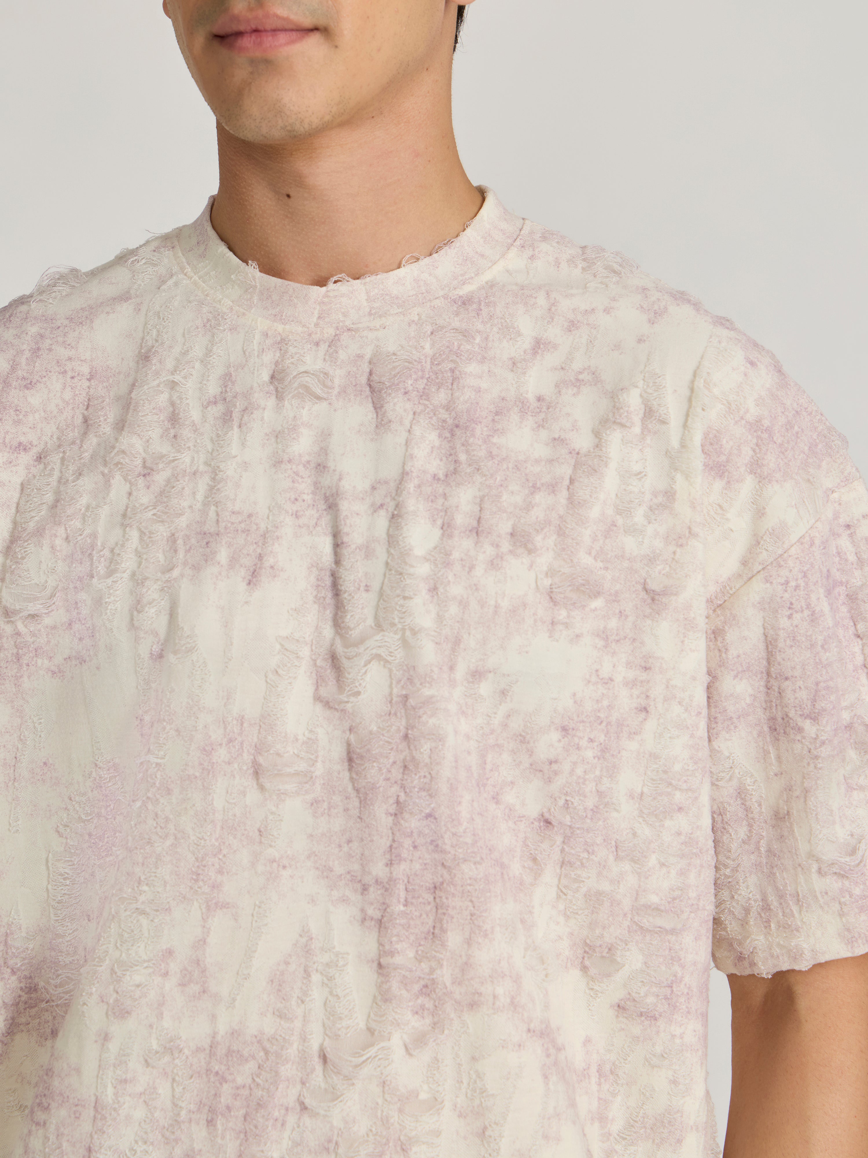 man wearing a Distressed Oversized T-Shirt - Pink