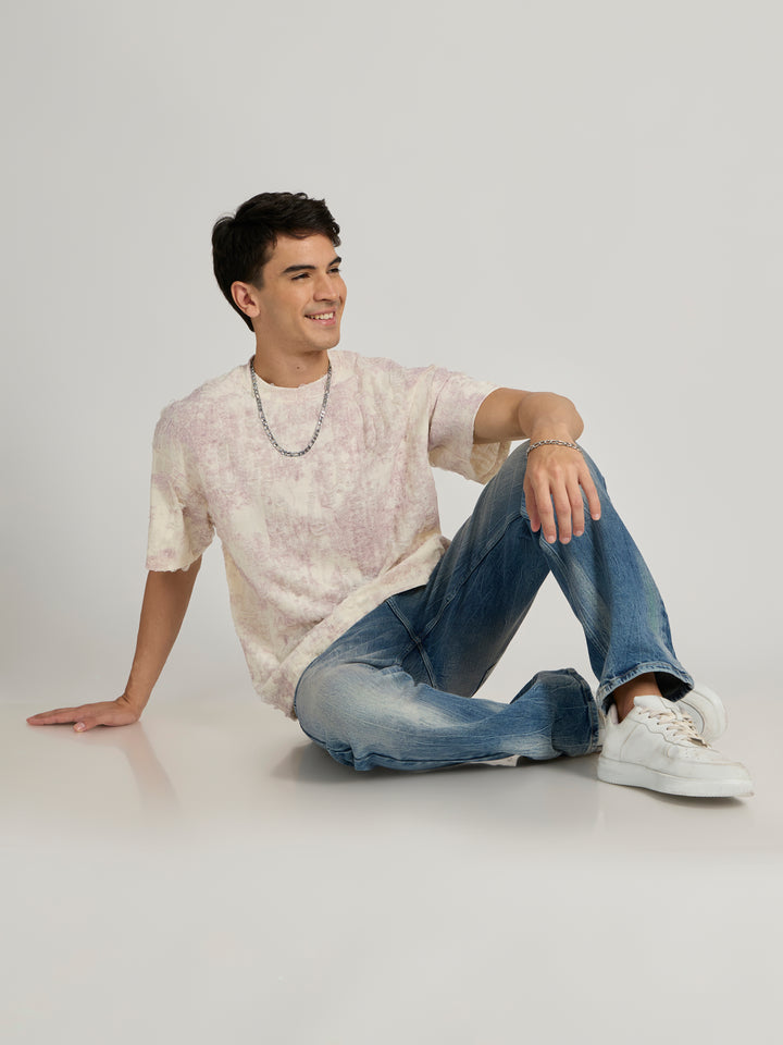 man wearing a Distressed Oversized T-Shirt - Pink