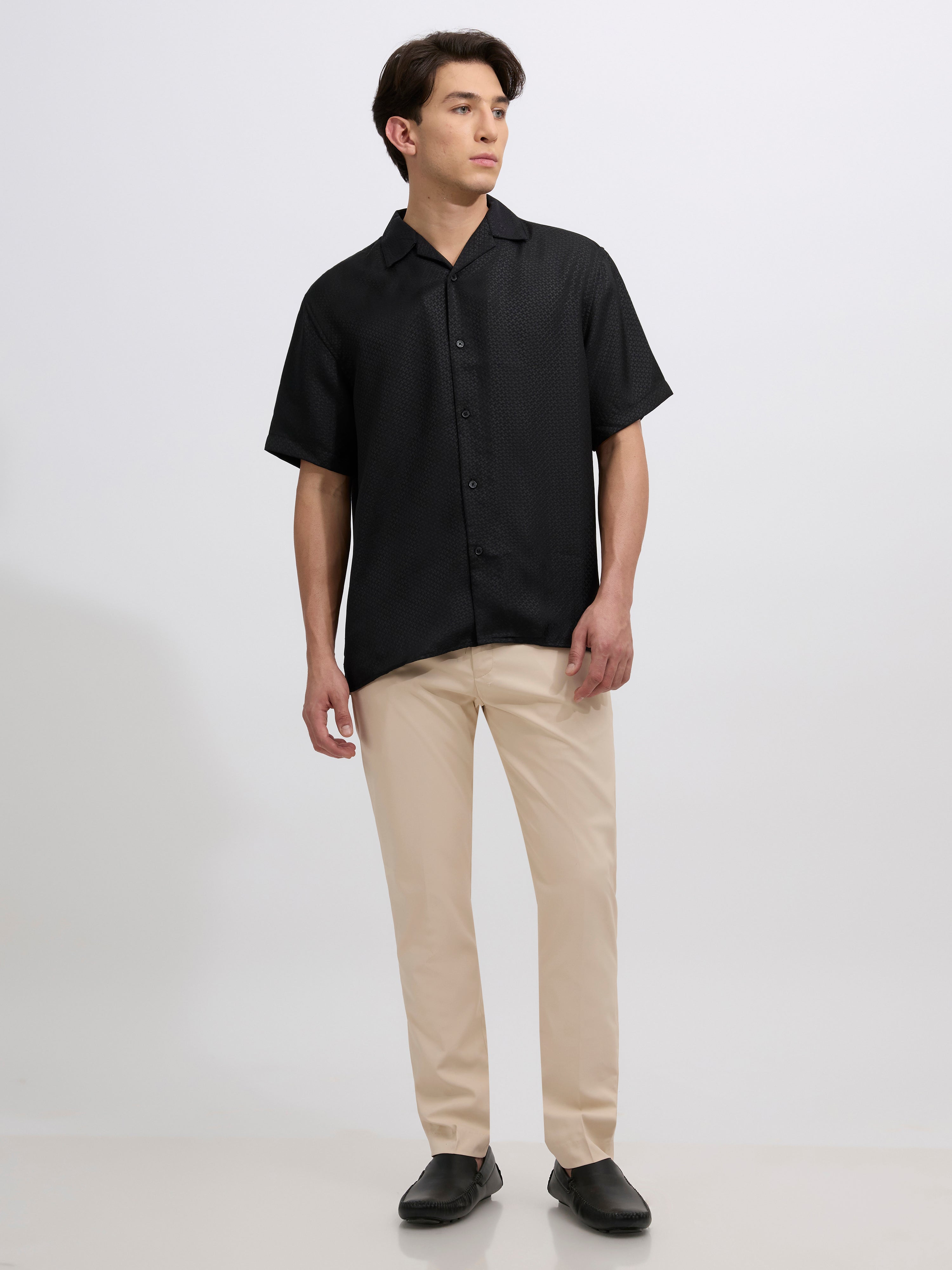 men's sand beige skinny fit trousers blended with polyster and spandex - paired with a black top and black shoes