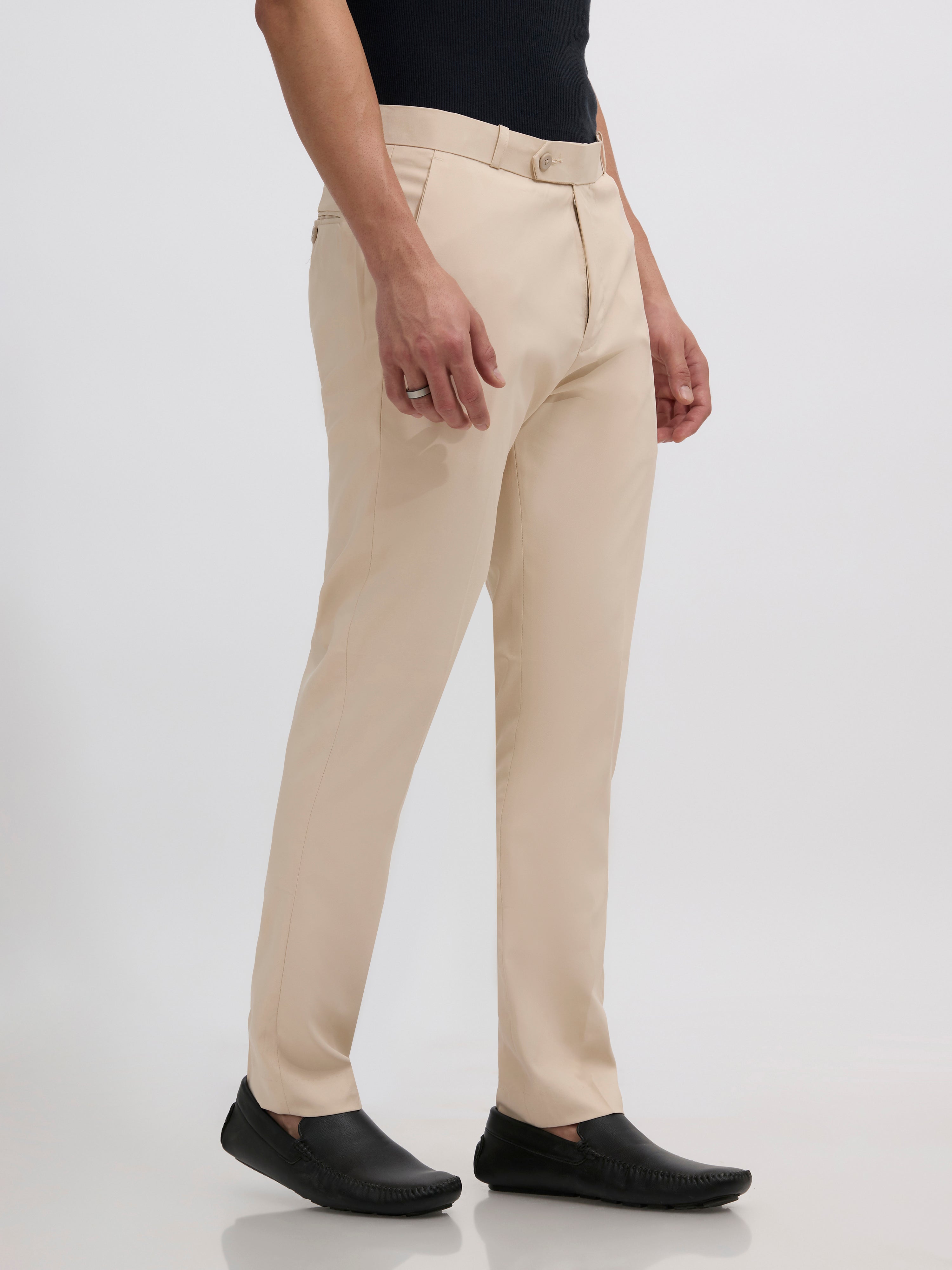 men's sand beige skinny fit trousers blended with polyster and spandex - paired with a black top and black shoes