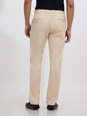 men's sand beige skinny fit trousers blended with polyster and spandex - paired with a black top and black shoes