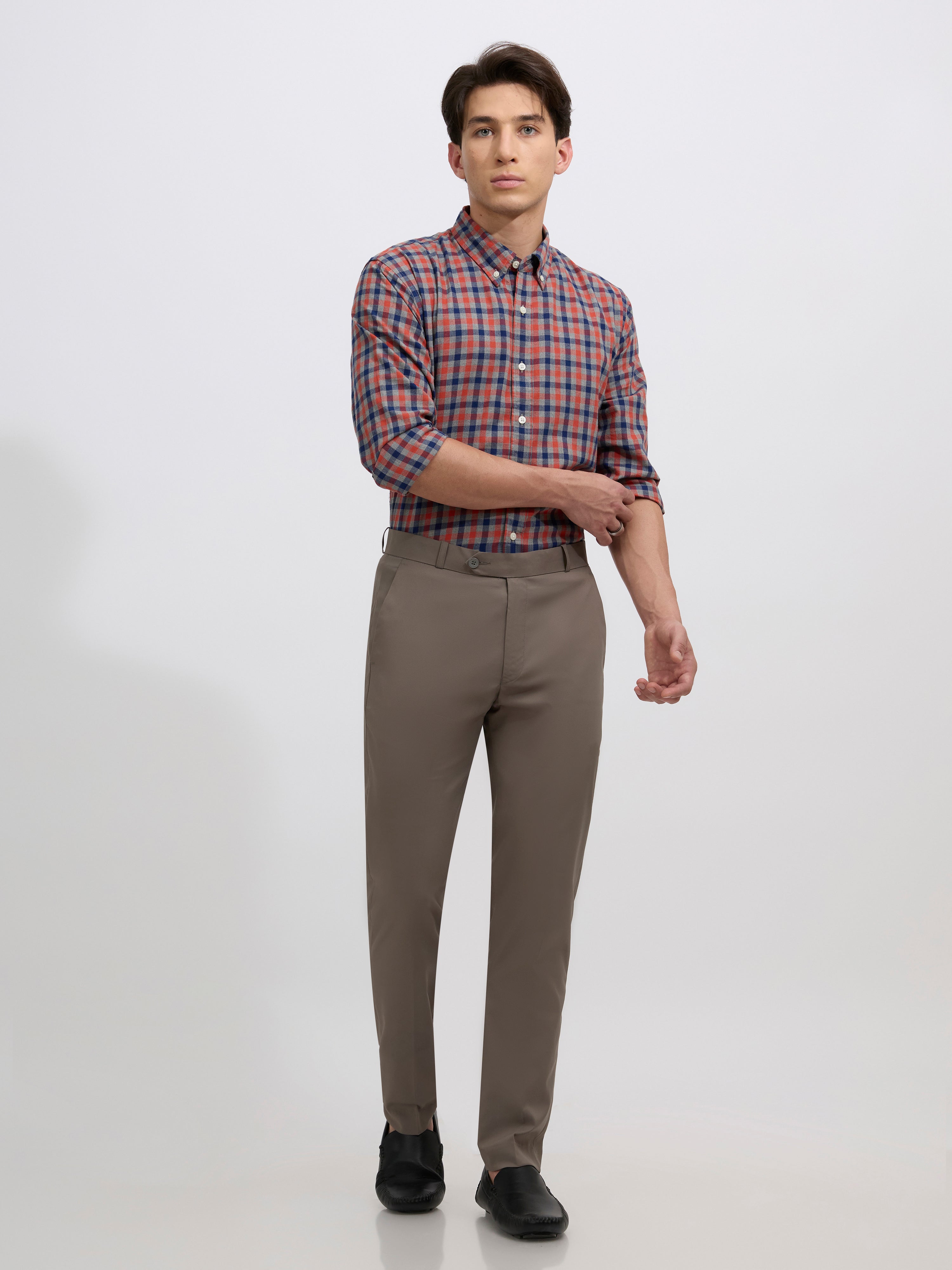 men's cement gray skinny fit trousers blended with polyster and spandex - paired with a black top and black shoes