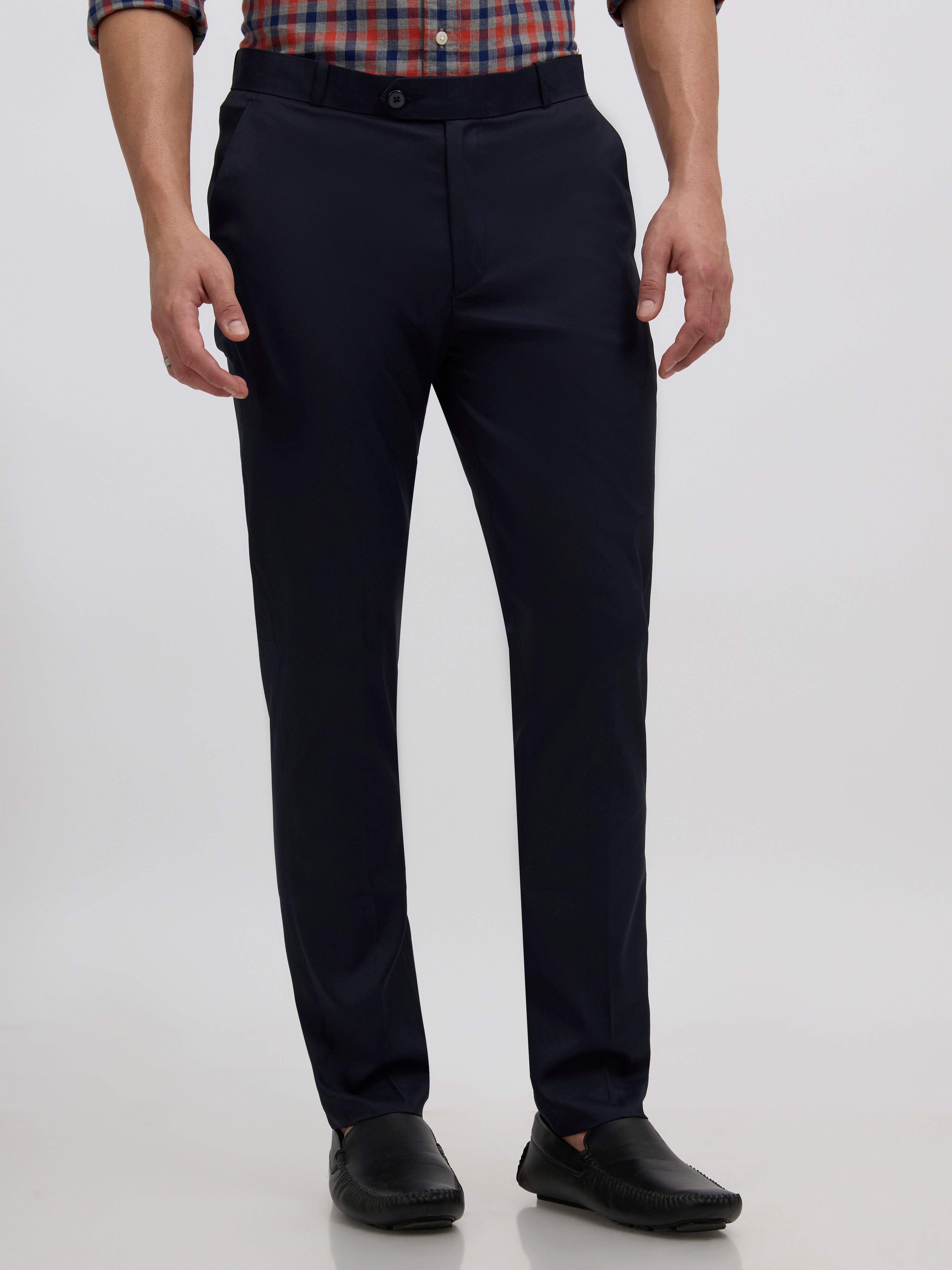 men's navy blue skinny fit trousers blended with polyster and spandex - paired with a black top and black shoes