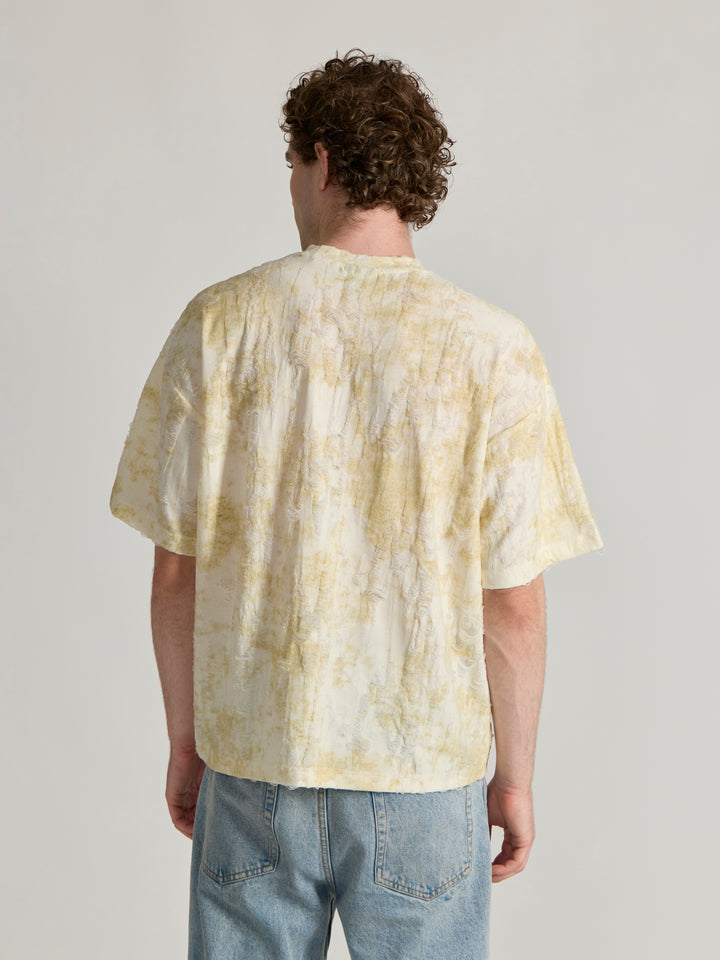 man wearing a Distressed Oversized T-Shirt - yellow