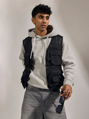 men's black zippered cargo vest with utility pockets and zip closure
trendy outfits for men