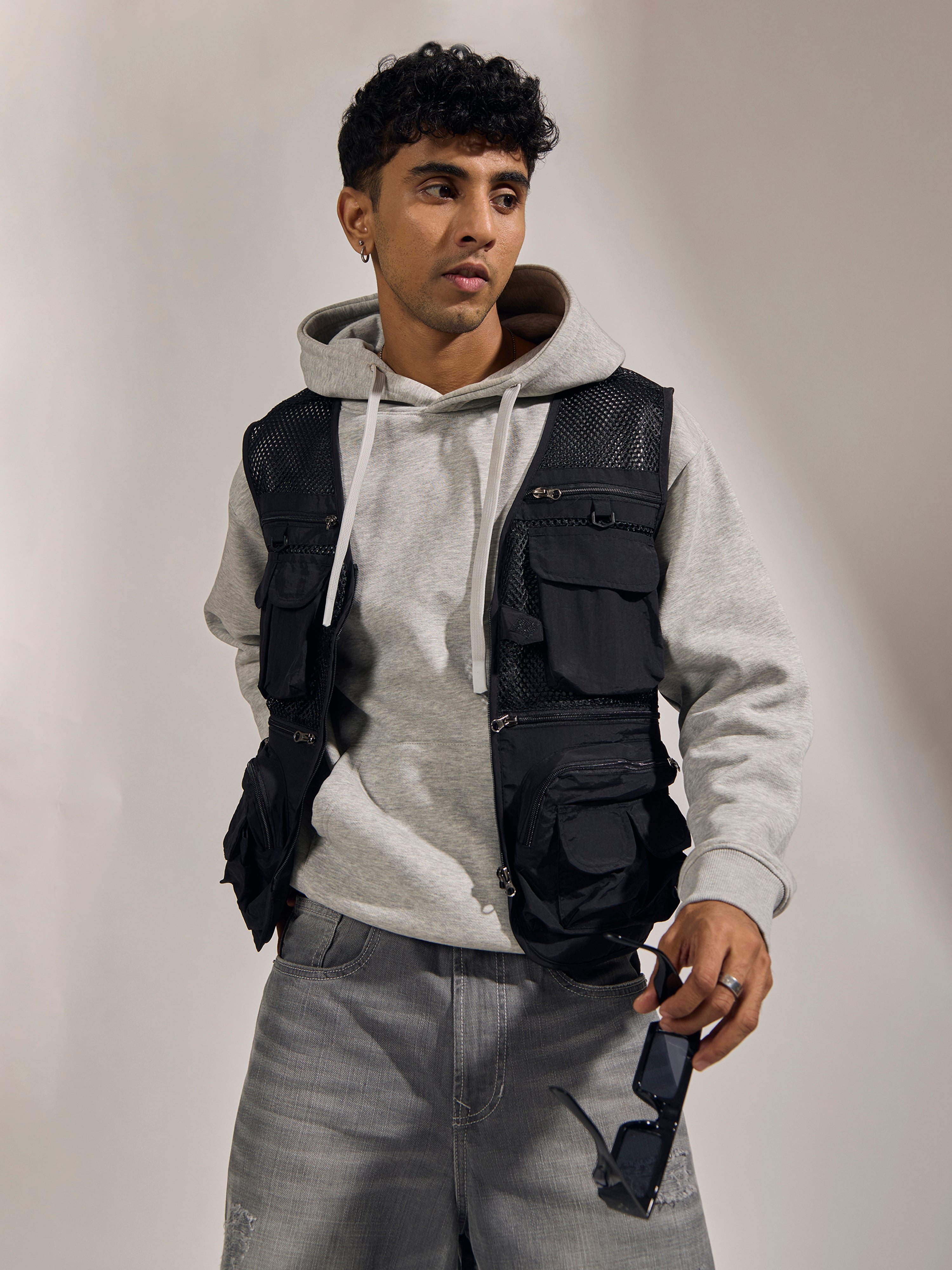 men's black zippered cargo vest with utility pockets and zip closure
trendy outfits for men