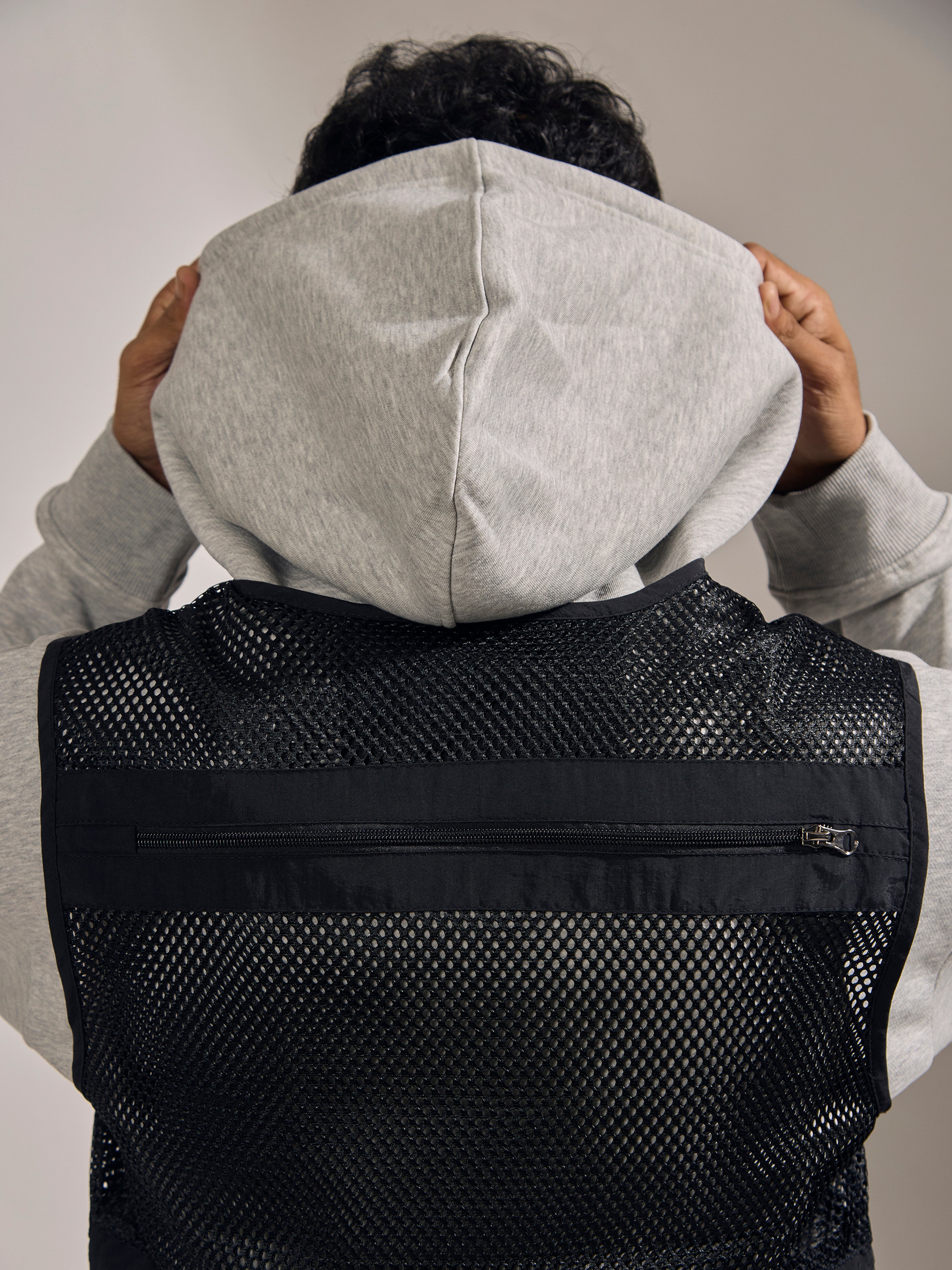 men's black zippered cargo vest with utility pockets and zip closure
trendy outfits for men