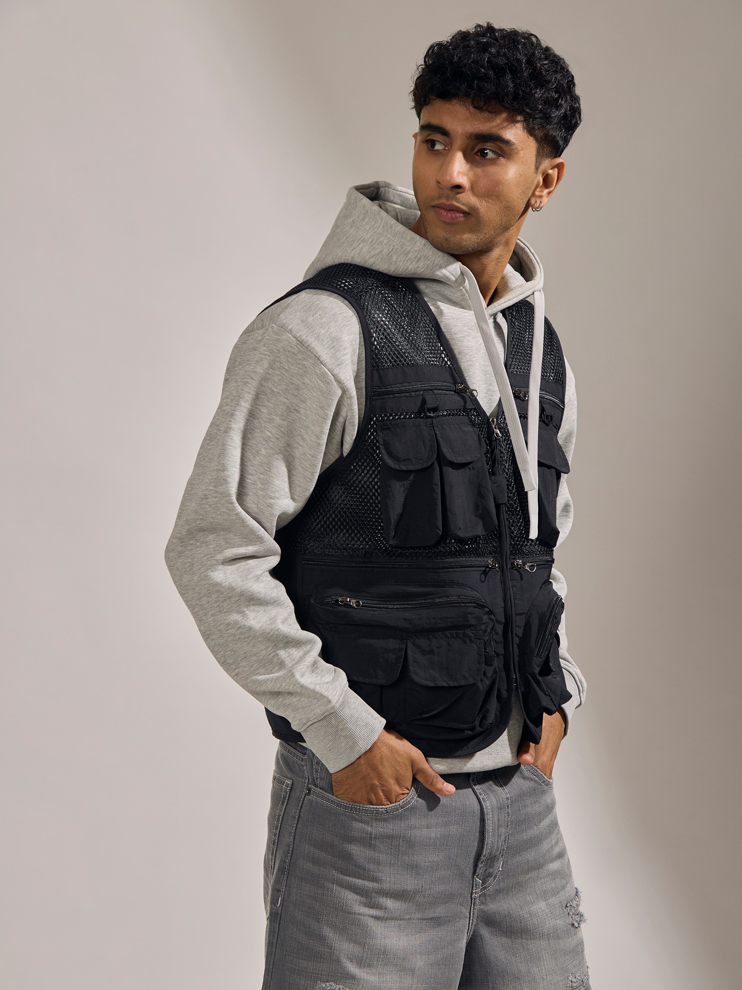 men's black  zippered cargo vest with utility pockets and zip closure
trendy outfits for men