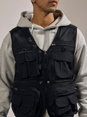 men's black zippered cargo vest with utility pockets and zip closure
trendy outfits for men